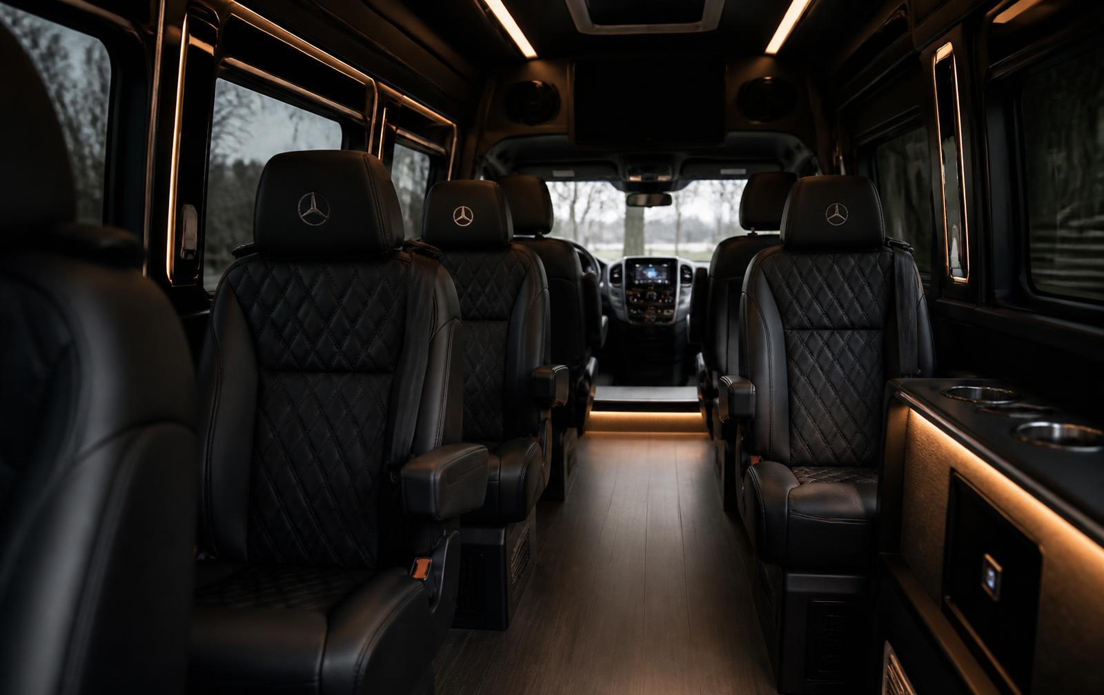 Interior of a premium passenger vehicle with quilted leather seating and warm accent lighting